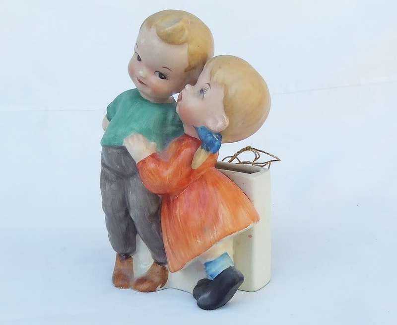 A very charming vintage Hummel look wall pocket or wall vase