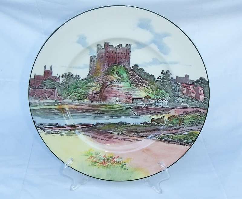 A stunning old cabinet or display plate depicting a castle scene made by Royal Doulton England
