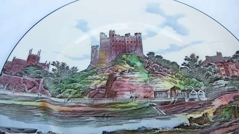 A stunning old cabinet or display plate depicting a castle scene made by Royal Doulton England
