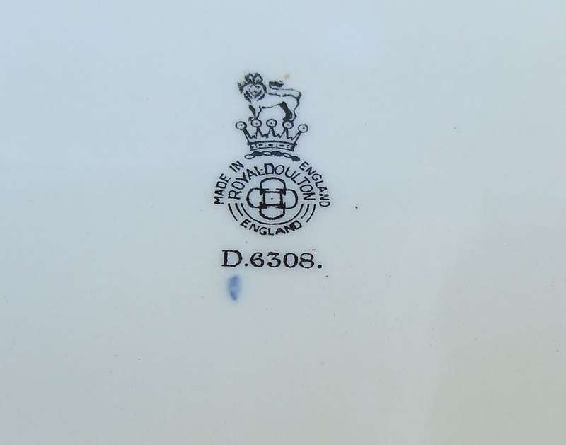 A stunning old cabinet or display plate depicting a castle scene made by Royal Doulton England