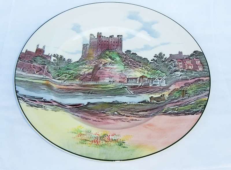 A stunning old cabinet or display plate depicting a castle scene made by Royal Doulton England