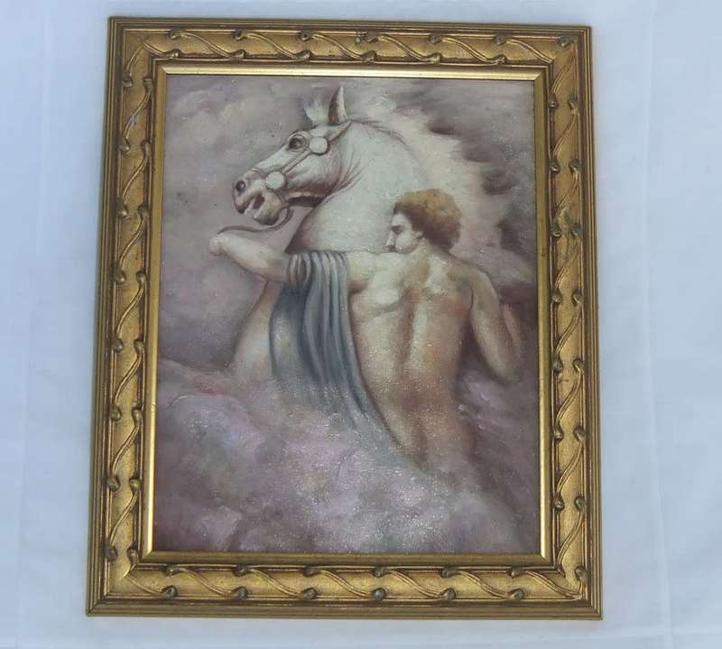 An eye catching framed oil painting depicting a man with a raging horse