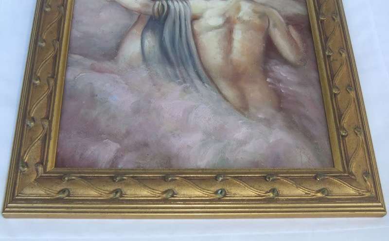 An eye catching framed oil painting depicting a man with a raging horse