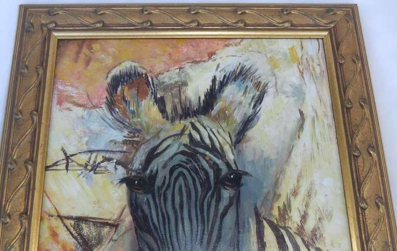 A stunning framed oil painting depicting a Zebra in great detail
