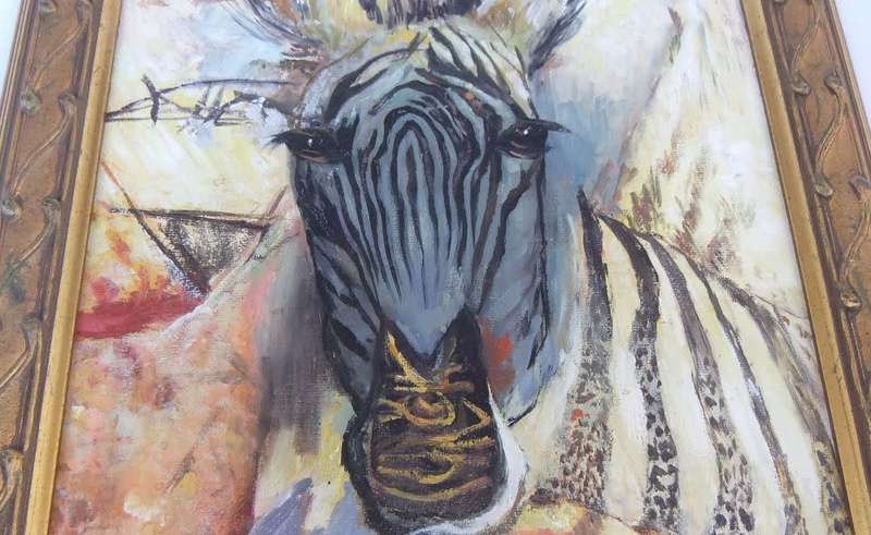 A stunning framed oil painting depicting a Zebra in great detail