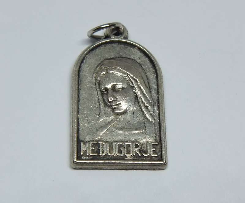 A lovely vintage solid metal religious pendant / medallion