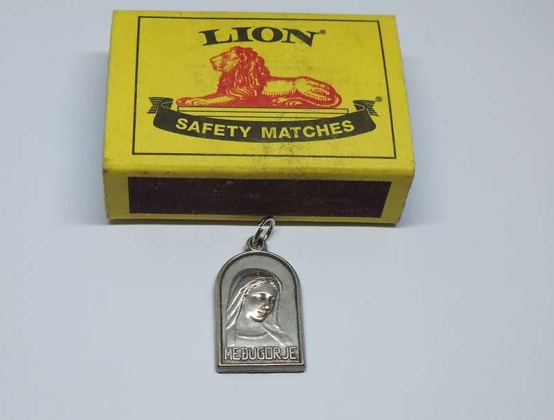 An interesting vintage solid metal religious pendant / medallion
