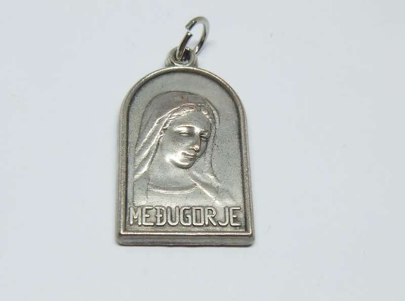 An interesting vintage solid metal religious pendant / medallion