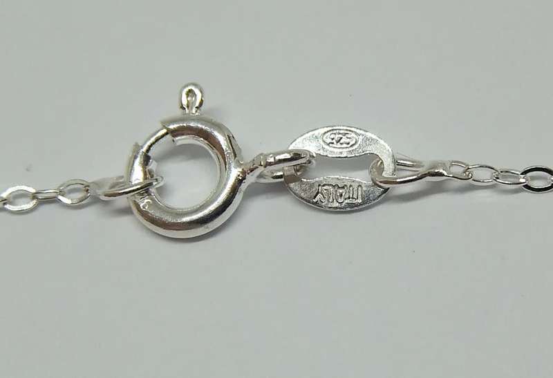 An unusually designed genuine sterling silver and other metal pendant & a sterling silver necklace