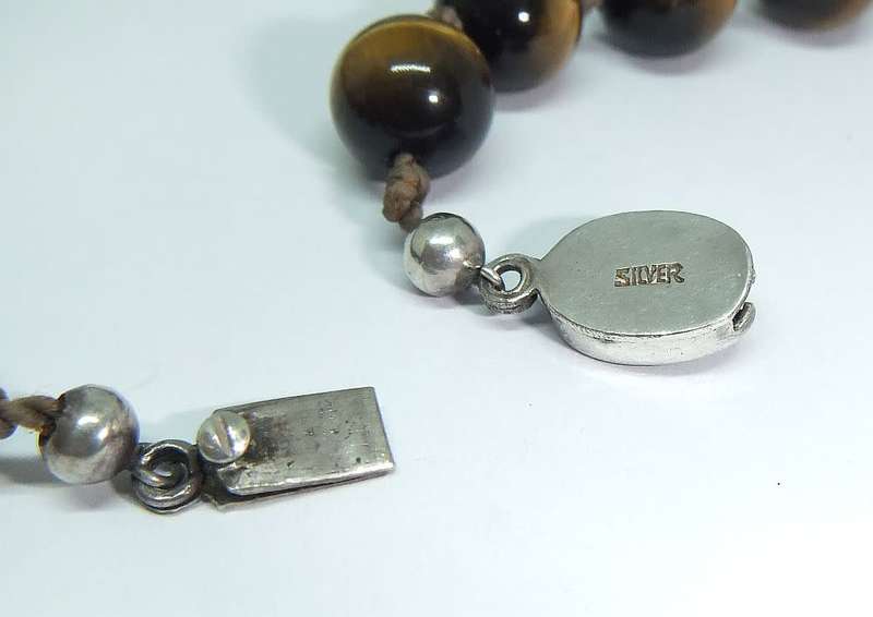 A rarely seen vintage genuine Tigers Eye gemstone orb necklace with a beautiful silver clasp