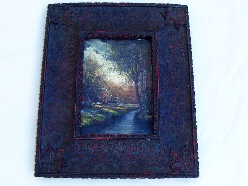 An original signed miniature oil painting depicting a cottage in the forrest with river passing