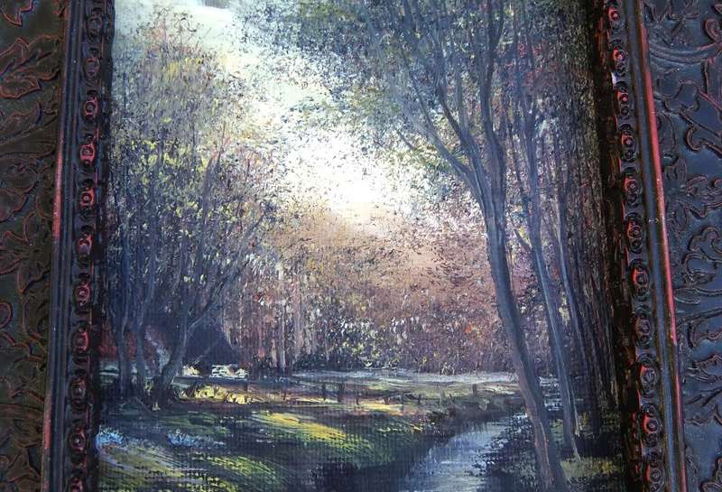 An original signed miniature oil painting depicting a cottage in the forrest with river passing