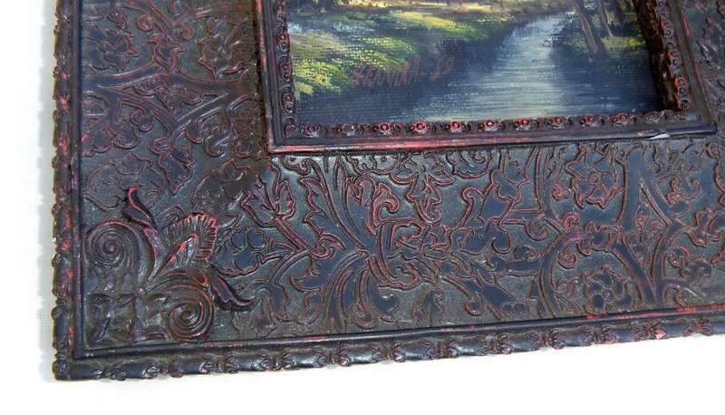 An original signed miniature oil painting depicting a cottage in the forrest with river passing