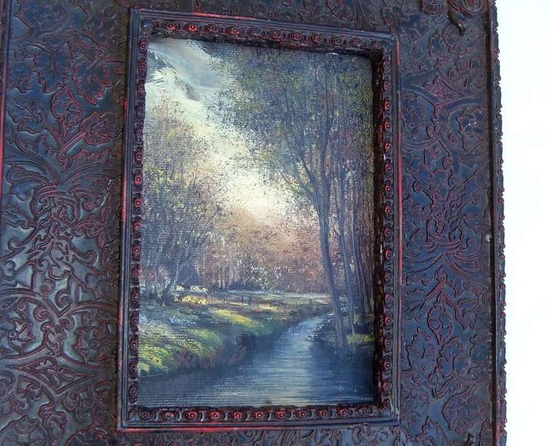 An original signed miniature oil painting depicting a cottage in the forrest with river passing