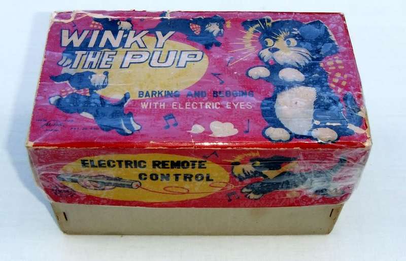 An awesome vintage Winky the Pup remote control dog , barking and begging with electric eyes