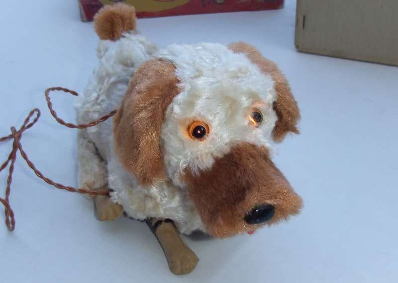 An awesome vintage Winky the Pup remote control dog , barking and begging with electric eyes