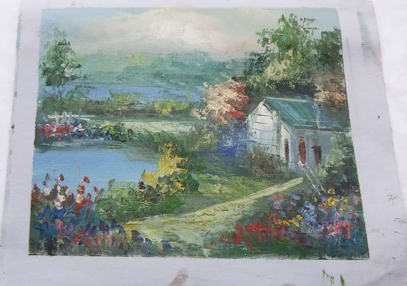A BEAUTIFUL UNFRAMED SIGNED GENUINE OIL ON CANVAS PAINTING OF A COTTAGE NEAR A COLOURFUL POND