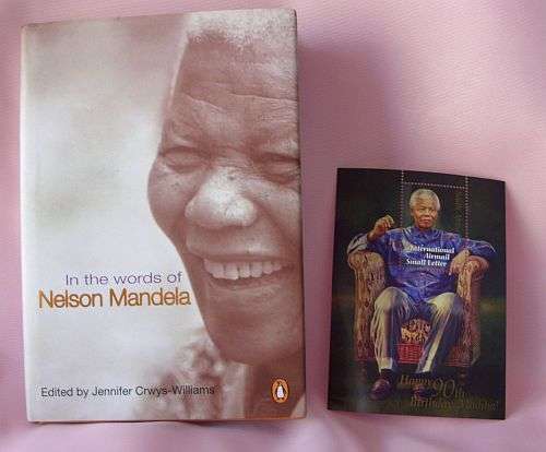 IN THE WORDS OF NELSON MANDELA PLUS AN INTERNATIONAL STAMP ( MINT ) - POSTAGE R30