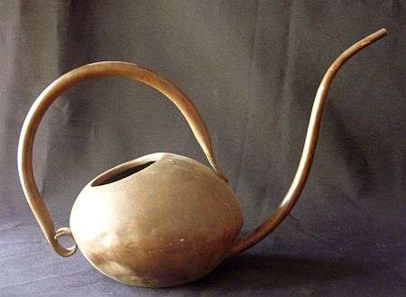 AN ANCIENT LOOKING COPPER WATERING CAN - POSTAGE R40