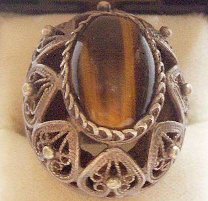 WOW !!! ISRAEL REUVEN DESIGNER STERLING SILVER AND TIGERS EYE RING - POSTAGE R25