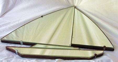 AN ART DECO TYPE BOAT SHAPED MIRROR