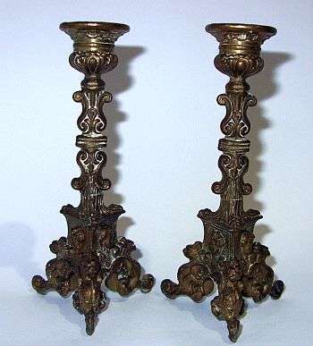 THE CUTEST PAIR OF ORNATE CANDLE STICKS WITH CHERUB MOTIF