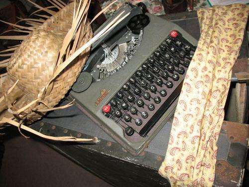 old type writer and hat and scarf