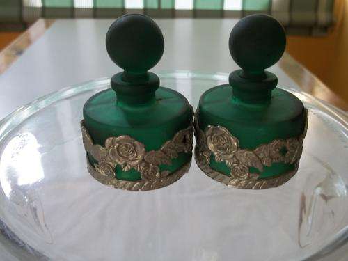 2 green perfume bottles wth rose motiff on pewterl??