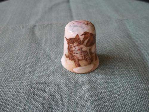 Hallmarked fine china thimble with pitcure of a doggie licking a kitty