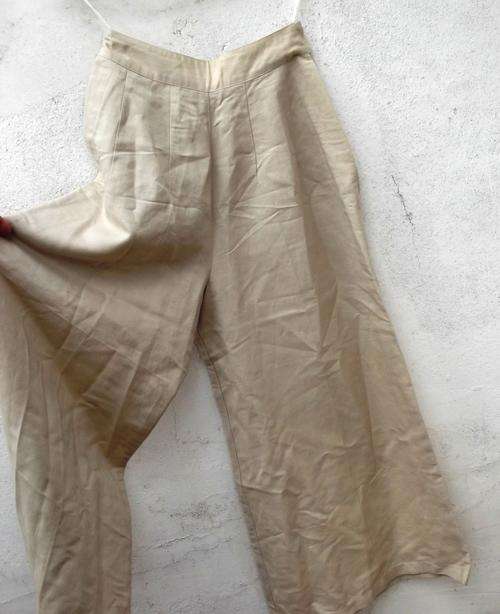 Dark cream colour pants with very wide legs, size 32, great conditon