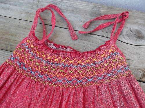 Dark orange dress for little girl by 'Etafeni', shweshwe material with smocking detail, size 6yrs