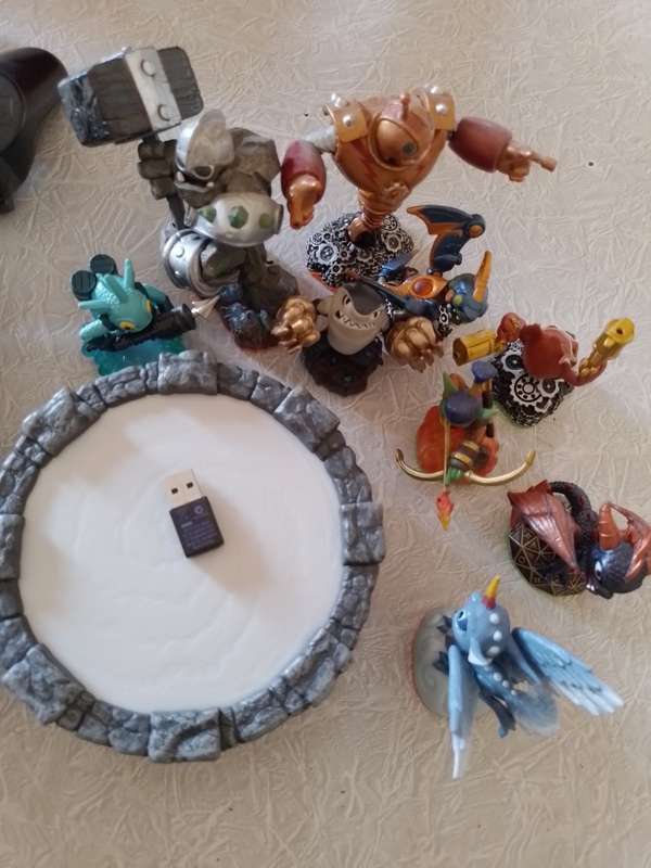 Ps3 Super Slim, remotes, games and Skylanders set