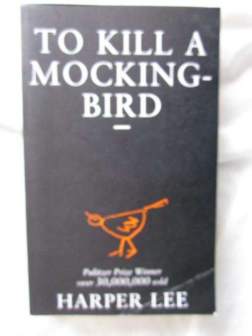 To Kill a Mocking Bird- Harper Lee- softcover , few koki marks in book