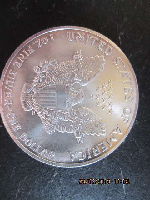 STUNNING UNC 1990 EAGLE/1 DOLLAR 1OZ FINE SILVER 1 of 2