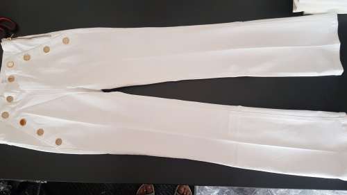 White jeans with gold buttons.  Size 26, 28, 30 and 34 available