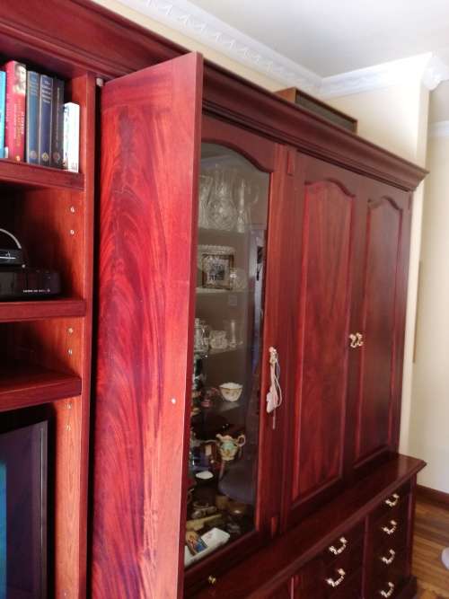 Solid Mahogany Display Unit. Retractable desk surfaces and doors. Could be white washed for kitchen