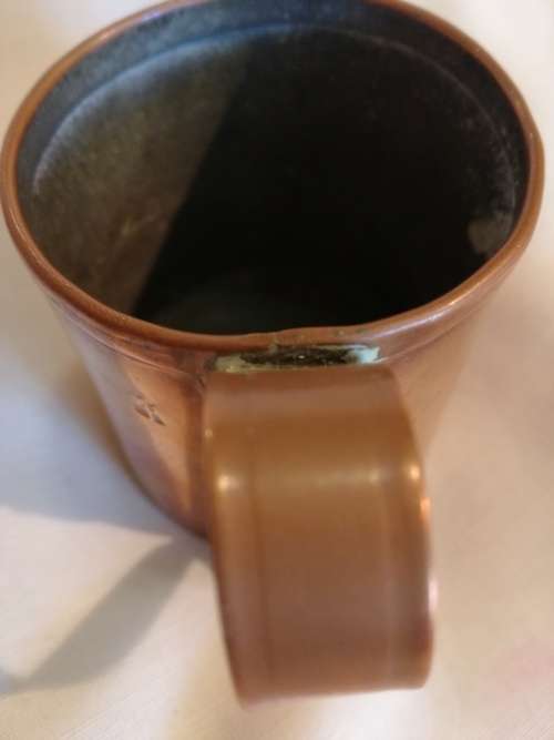 A pair of 19th Century Copper Measuring jugs