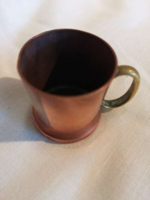 A pair of 19th Century Copper Measuring jugs