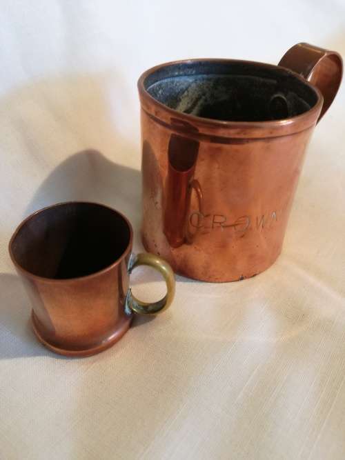 A pair of 19th Century Copper Measuring jugs