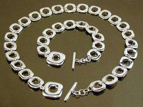 BEAUTIFUL  925 STERLING  SILVER PLATED HOLE NECKLACE AND BRACELET SET