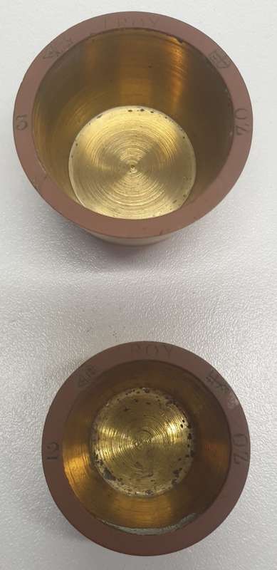Antique 7 pce set of brass Troy ounce nesting cup weights.