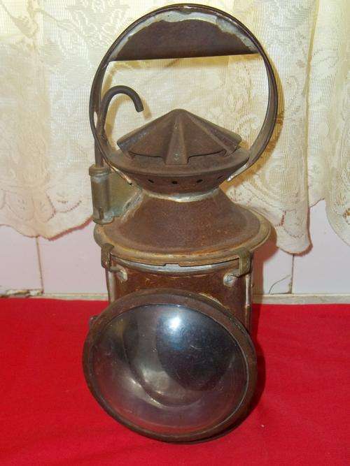 VERY OLD AND RUSTY SOUTH AFRICAN RAILWAY SIGNAL LAMP.