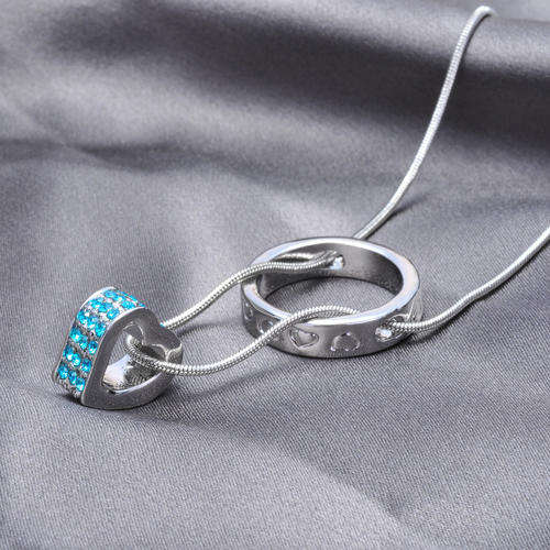 silver ring and aqua heart necklace with snake chaub\