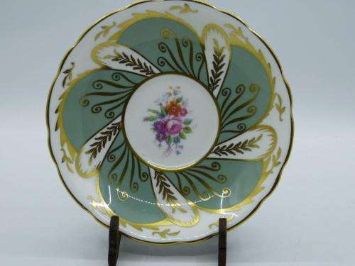 PARAGON VINTAGE GILDED AND SAGE-GREEN FOOTED TEA CUP AND SAUCER WITH CABBAGE ROSES.