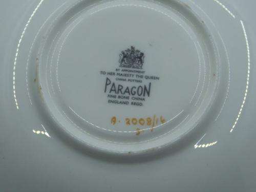 PARAGON VINTAGE GILDED AND SAGE-GREEN FOOTED TEA CUP AND SAUCER WITH CABBAGE ROSES.