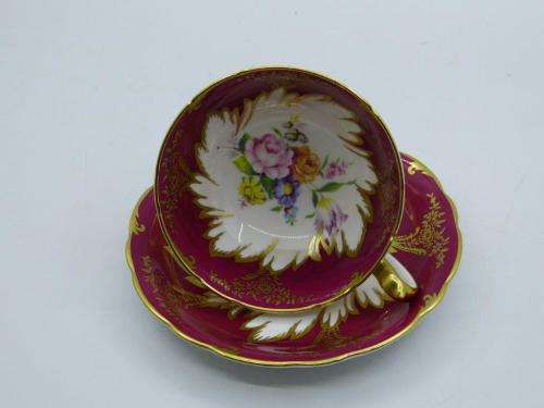 PARAGON GILDED AND CARDINAL RED VINTAGE TEA CUP DUO WITH CABBAGE ROSES .