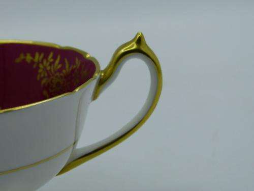 PARAGON GILDED AND CARDINAL RED VINTAGE TEA CUP DUO WITH CABBAGE ROSES .