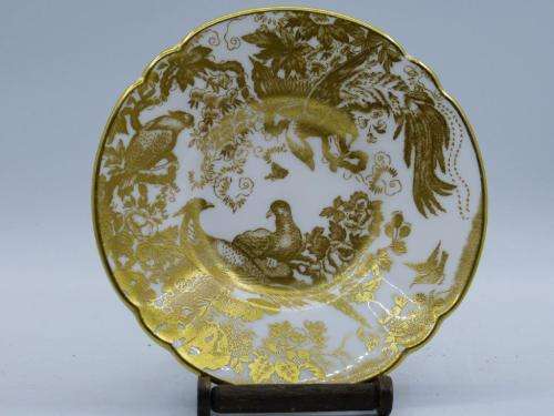 ROYAL CROWN DERBY DEMI TASSE AND SAUCER IN THE GOLD AVES  PATTERN.