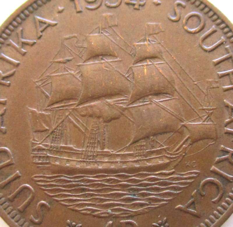 A 1954 SOUTH AFRICA PENNY---Very good detail but has a curl on the rim