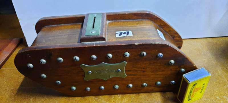 Vintage wooden money box in shape of tank